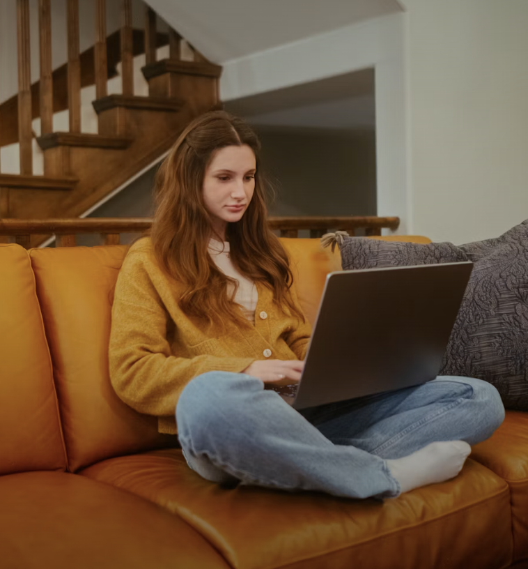 A business owner is reading a blog from Olivia's Desk that includes tips on content personalization from an organic growth copywriter.